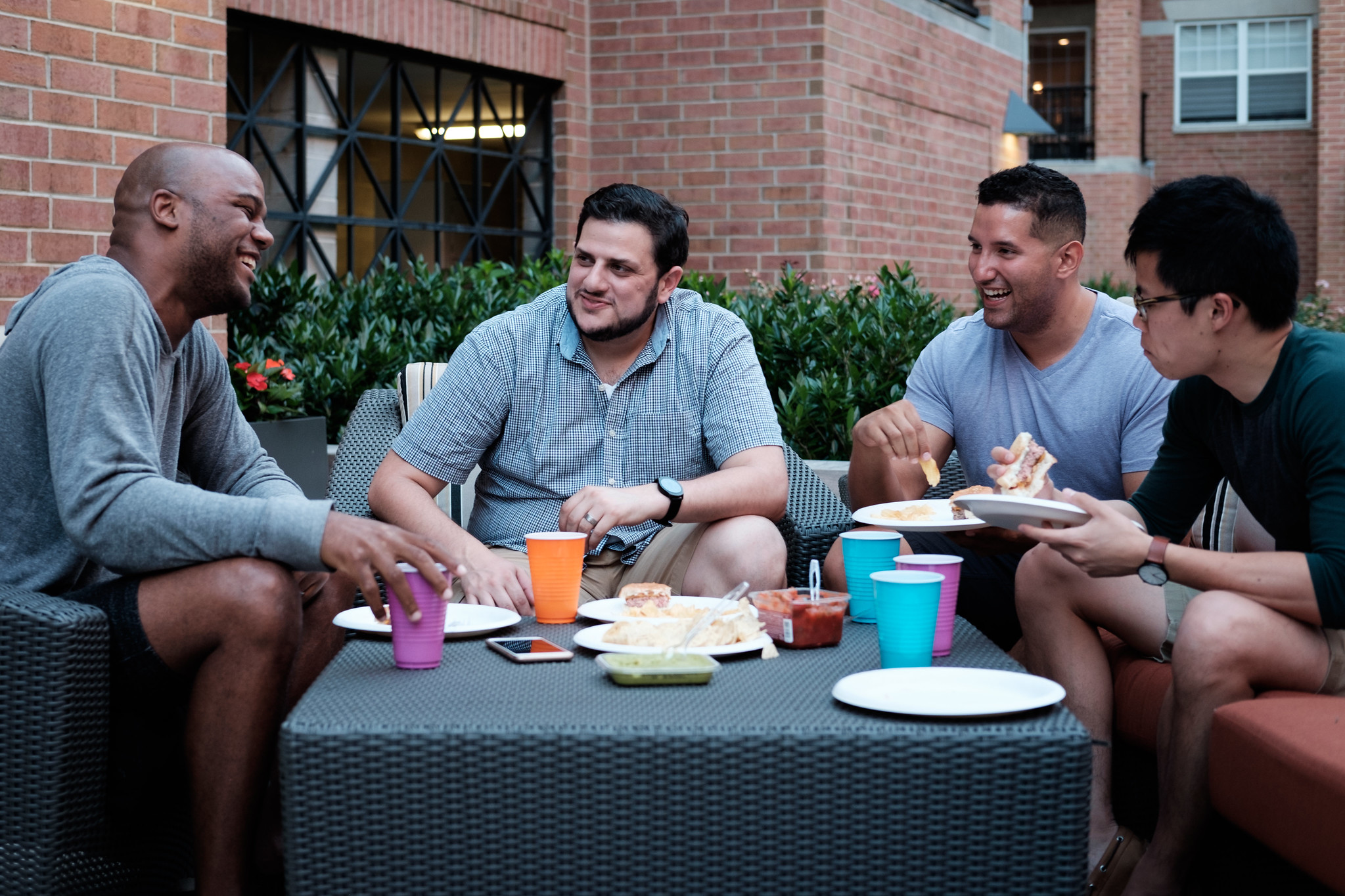 Small group gathered around a campfire for a nighttime discussion and fellowship